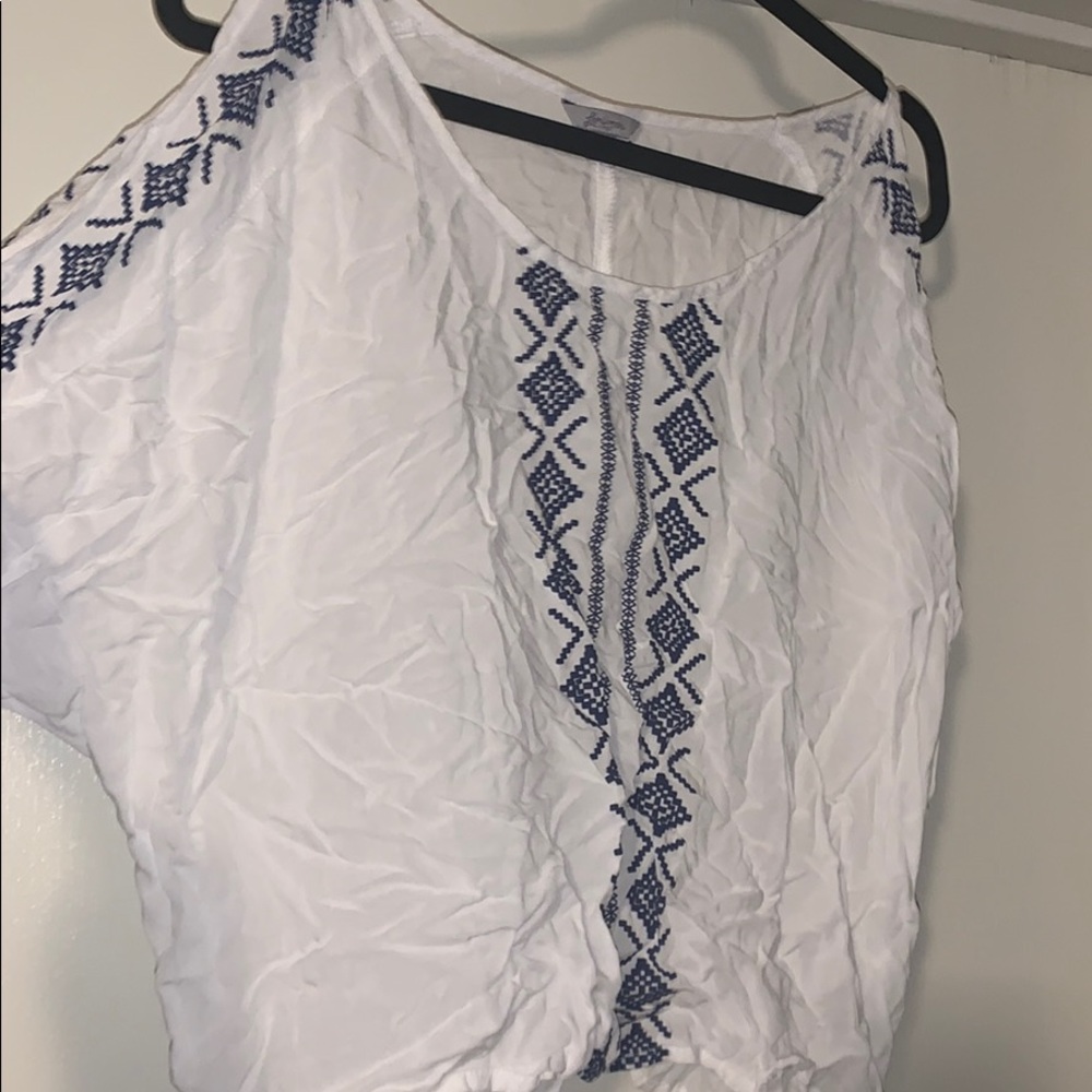 White blouse with shoulder cutouts
